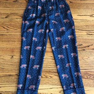 silk, cropped, pants that feature lions on them.